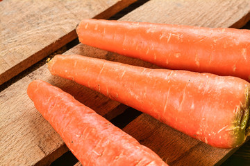 Carrot on wooden surface