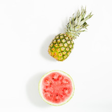 Whole Pineapple And Sliced Watermelon On White Background, Top View