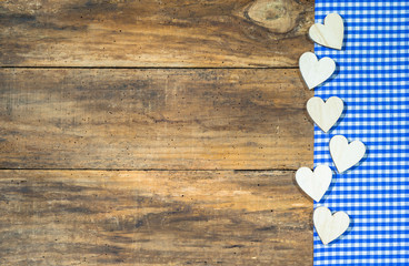 Wall Mural - Oktoberfest Bavaria background with hearts and blue white checked tablecloth