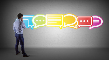 Wall Mural - businessman using social network interface on a wall 3d rendering