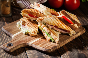 Wall Mural - Stack of panini with ham, cheese and lettuce sandwich