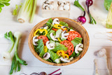 Fototapeta Kuchnia - vegetable salad bowl on kitchen table, balanced diet