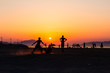 © Roman_23203 - Silhouetted shot of young people are having fun on beach and playing football
