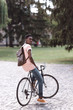© LIGHTFIELD STUDIOS - afro student with bicycle
