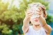 © yanadjan - Child drinks water.