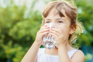 Child drinks water.  