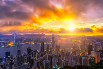 Fototapete - Hong Kong City skyline at sunrise. from night to day