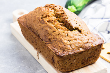 Zucchini loaf bread on concrete background.  Selective focus, space for text.