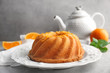© Africa Studio - Plate with delicious citrus cake and orange zest on light table