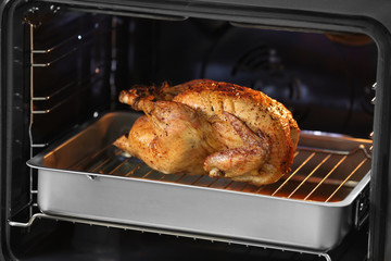 Sticker - Golden roasted turkey on baking tray in oven