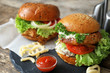 © Africa Studio - Tasty turkey burgers on slate plate