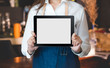 © weedezign - Close up on blank tablet computer that barista show and holding with two hand in front of coffee shop counter bar,Mock up space for display of menu or design
