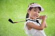 Leinwandbild Motiv Asian Chinese little girl playing golf