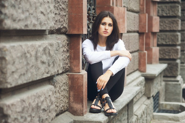 Wall Mural - Fashion model on the street. Beautiful young woman in stylish summer clothes