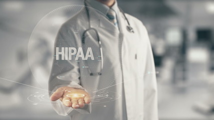 Canvas Print - Doctor holding in hand HIPAA