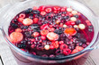 Homemade compote of berries in a glass pan closeup