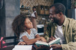 © LIGHTFIELD STUDIOS - Father and daughter reading book