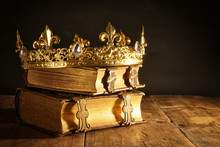 Low Key Of Beautiful Queen/king Crown On Old Books. Vintage Filtered. Fantasy Medieval Period