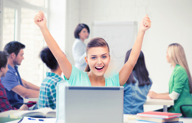 Canvas Print - happy student girl with laptop at school