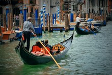 Gondola In Canal In Venice