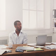 © Prostock-studio - Thoughtful young black man enjoying his successful business