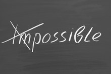 Impossible Possible. Text On Chalkboard