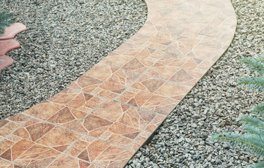 Sticker - Pathway made from ceramic tiles with crushed stone in garden