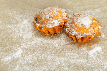 Two appetizing round cakes on a blurred light background.