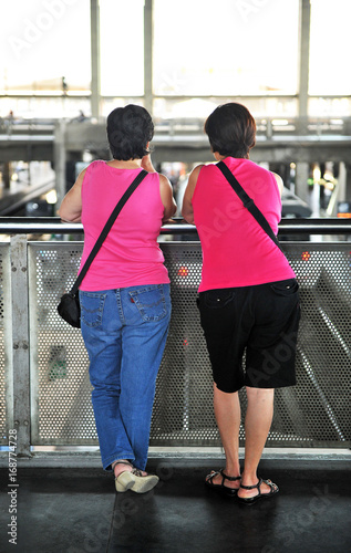 Two women waiting for the arrival of the train, Spain Poster