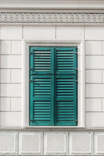 Building Facade Detail/Blue Window Shutter On White Facade
