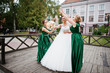 © AS Photo Family - Fabulous bride walking, posing and having fun with her bridesmaids in the downtown on a wedding day.