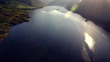 Tilting Aerial View Of Sunrise In The Lake District, UK.