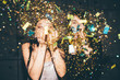 © pavloffav/Stocksy - Two girl blowing golden confetti at camera