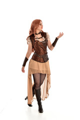 Canvas Print - full length portrait of red haired lady wearing steampunk inspired outfit, standing pose against a white background.