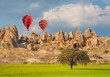 © muratart - Hot air balloon flying over spectacular Cappadocia