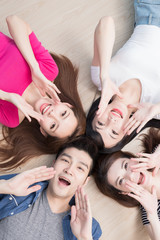 Wall Mural - young people lying on floor