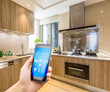 © zhu difeng - smart phone in modern kitchen