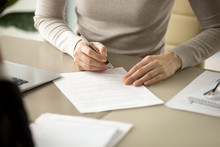 Woman Signing Document, Focus On Female Hand Holding Pen, Putting Signature At Official Paper, Subscribing Name In Statement With Legal Value, Contract Management, Good Business Deal, Close Up View