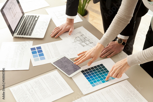 Close Up View Of Interior Designers Teamwork With Pantone Swatch