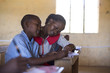 © Hugh Sitton - Teacher teaching in classroom with school children. Kenya, Africa.