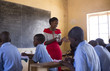 © Hugh Sitton - Teacher with students in classroom. Kenya, Africa.