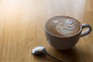 Coffee cup on the table, latte art