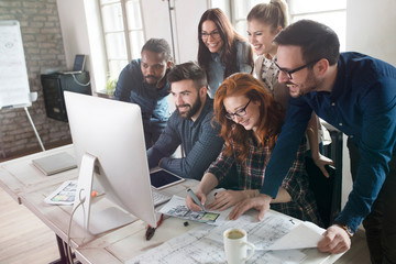 Group of young designers working as team