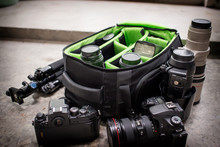 Photographer Pack His Camera And Lenses To Bagpack.