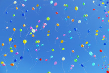 Air Multicolored Balloons Flying To Bright Blue Sky