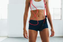 Close-up of a fit woman in the gym.