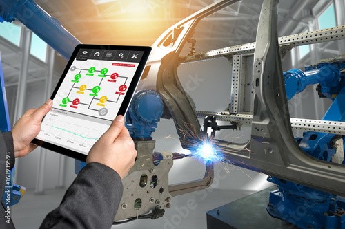 Fotografie, Obraz Male manager hand use tablet for check real time vibration analysis monitoring system application in smart factory