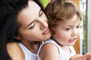 Mother hugs daughter