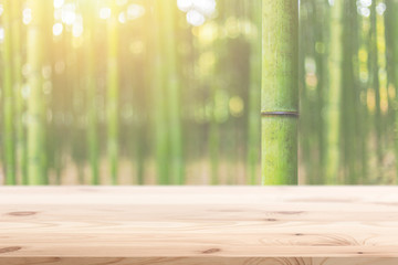 Wood foreground with blur bamboo wood forest background design for display nature products