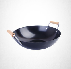 wok or asian cooking wok on a background.